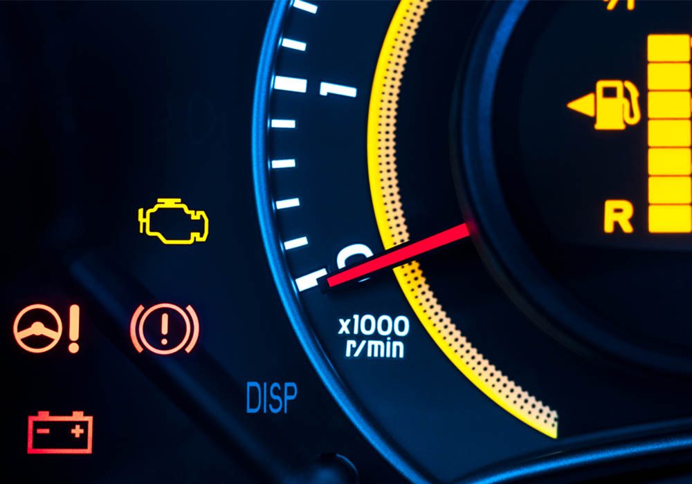 Car Diagnostics Milton Keynes Car Diagnostics display showing warning lights and RPM gauge.